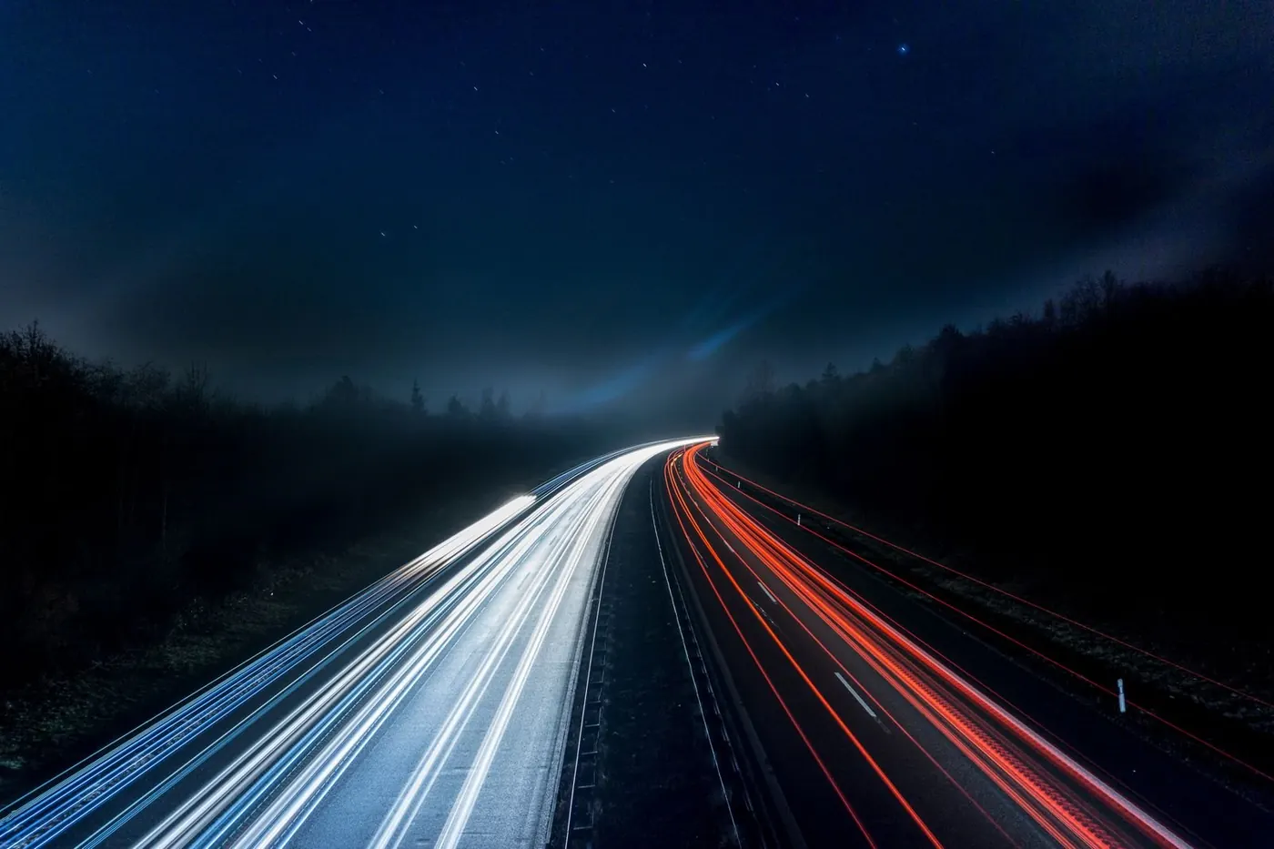 Car light trails on a highway at night